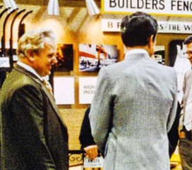 Jerry Dowling, left, chats with visitors to the company's exhibit at a past fence industry trade show.